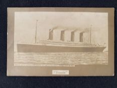 R.M.S. TITANIC: Rare post-disaster privately printed postcard of Titanic at sea.