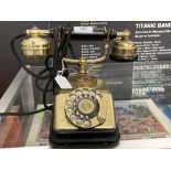 Early 20th cent. Danish brass and bakelite, finger dial telephone.