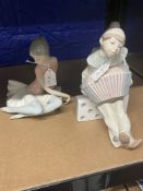 20th cent. Ceramics: Lladro seated ballerina in a pink blouse, plus boy seated on a domino playing