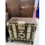 19th cent. Chinese hardwood campaign chest, fall front with decorated alloy mounts. 34½ins. x 18½