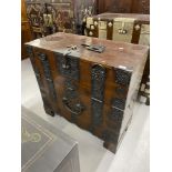 19th cent. Chinese hardwood campaign chest, fall front with decorated iron mounts and carrying