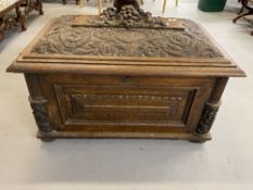 Period Gothic oak sarcophagus shaped cellarette with heavily carved domed lid and partially