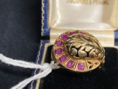 Jewellery: Yellow metal ring set with eight rubies, open setting, estimated weight of (8) 0.45ct.