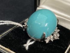 Jewellery: White metal ring set with an oval turquoise 25mm x 20mm and thirty brilliant cut