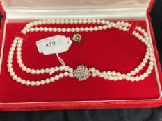 Jewellery: Necklet double row of (73, 69) 6.5mm cultured pearls attached to a 21mm round white metal