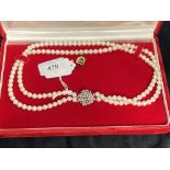 Jewellery: Necklet double row of (73, 69) 6.5mm cultured pearls attached to a 21mm round white metal