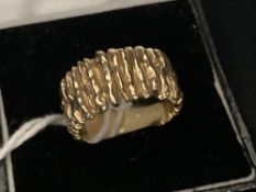 Jewellery: Yellow metal ring granulated bark finish, tests 14ct. 7.6g.