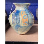 Studio Pottery: Richard Wilson baluster vase with flared rim, decorated in pastel hues. Seal mark to