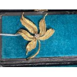 Jewellery: Yellow metal brooch, leaf design centre set with six brilliant cut diamonds, estimated
