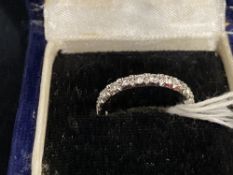 Jewellery: White metal ring set with twenty two 2mm brilliant cut diamonds, estimated weight of (22)