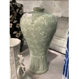 20th cent. Oriental pale green baluster shaped vase, slender neck rim decorated with cranes and