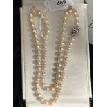 Jewellery: Necklet single row of (69) 7.5mm cultured pearls with a white metal knotted 14mm circular