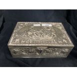 Continental white metal, marked and tested 800, desk lidded box, repousse decoration of vines with