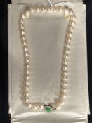 Jewellery: Necklet single row of (45) 7.5mm cultured pearls with a white metal 11mm circular clasp