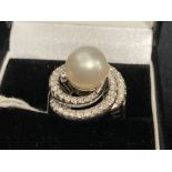 Jewellery: White metal ring cluster, centre set with a single 9mm cultured pearl surrounded by fifty