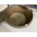 19th cent. Circular brass large cooking pot, dia. 25ins. with iron handle 26ins.