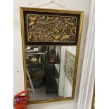 20th cent. Oriental rectangular mirror in gilt frame with carved panel of foliage, birds and