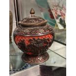 Mid 20th cent. Chinese black on red cinnabar lacquer baluster shaped vase, floral pattern roses