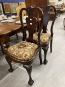 18th cent. Rosewood dining chairs, acanthus splat backs on ball and claw supports. A pair.