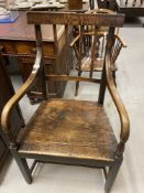 Late 18th cent. English oak elbow chair.