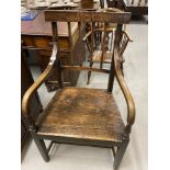 Late 18th cent. English oak elbow chair.