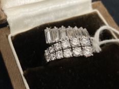 Jewellery: White metal ring crossover cluster one side set with twelve graduated brilliant cut