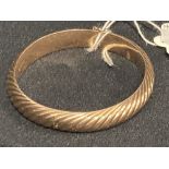 Jewellery: Yellow metal bangle, barley twist pattern. Stamped 14K. Tests as 14ct gold. Weight 26.