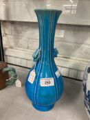 Chinese turquoise glazed bottle vase, pear shaped body supporting a slender neck, with two dragon