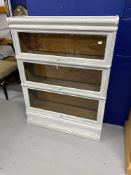 20th cent. Painted white Globe Wernecke style glass fronted bookcase with three shelves. Height