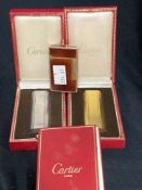 Smoking Requisites: Cartier Paris, matching yellow and white metal lighters, both boxed. Plus Dupont