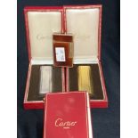 Smoking Requisites: Cartier Paris, matching yellow and white metal lighters, both boxed. Plus Dupont