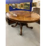 19th cent. Birds eye maple tilt top table on a single column support with four splayed feet on