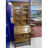 20th cent. Oak bureau bookcase with glazed top and turned stretchers.