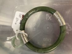 Jewellery: Oriental Chinese jade bangle with silver fittings and a jade ring as an entwined band