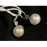 Jewellery: White metal earrings each set with a single 11.5mm cultured pearl. Tests as 14ct gold.