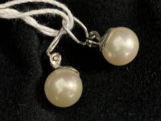 Jewellery: White metal earrings each set with a single 11.5mm cultured pearl. Tests as 14ct gold.