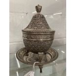 Chinese white metal tests as 800 standard, lidded pot with tripod stand decorated with double headed