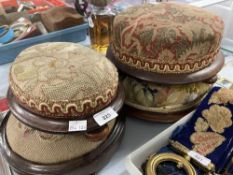19th cent. Circular footstools, all on mahogany bases, one with tapestry upholstery, one Berlin bead