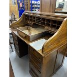 Early 20th cent. Oak tambour roll top desk by C. Pilter, four drawers either side of kneehole and