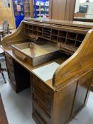 Early 20th cent. Oak tambour roll top desk by C. Pilter, four drawers either side of kneehole and