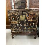 19th cent. Black lacquer Chinese cabinet on stand, decorated with two women watching eight boys