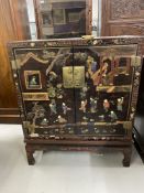 19th cent. Black lacquer Chinese cabinet on stand, decorated with two women watching eight boys