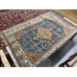 20th cent. Blue ground Persian rug. 66ins. x 50ins.