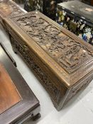 Chinese camphor wood blanket box decorated with a battle scene. 21ins. x 47ins.