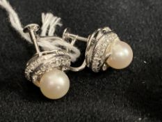 Jewellery: White metal earrings each set with an 8mm cultured pearl and twenty six brilliant cut