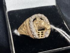 Jewellery: Yellow metal ring, the top in the form of a horse's head and shoe set with fourteen