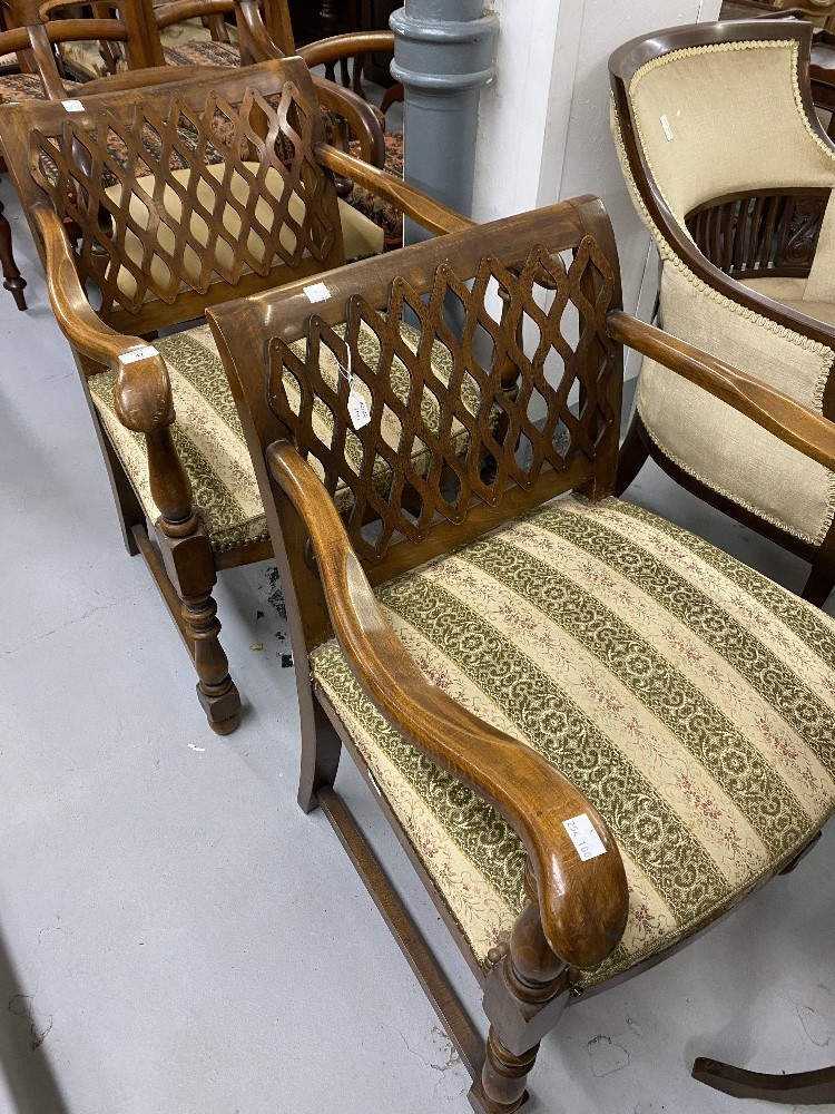 Early 20th cent. Beech armchairs with spring upholstered seats, fretwork backs and turned front