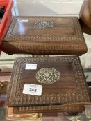 20th cent. Asian treen boxes heavily carved with white metal inset lotus flower decoration.