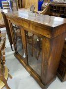 19th cent. Walnut display case with fruitwood inlay and glazed double doors.