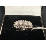 Jewellery: White metal ring set with four brilliant cut diamonds, estimated weight of (4) 0.80ct,